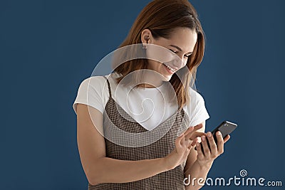 Happy woman using phone, reading funny news, laughing isolated Stock Photo