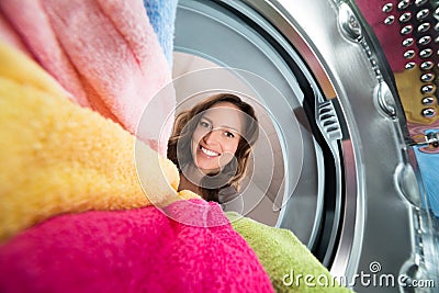 Happy Woman View From Inside The Washer Stock Photo