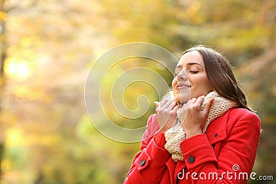 Happy woman warmly clothed in autumn Stock Photo