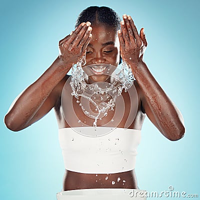 Happy woman, water splash and face cleaning, skincare and hygiene for fresh body, wellness and cosmetic beauty on studio Stock Photo