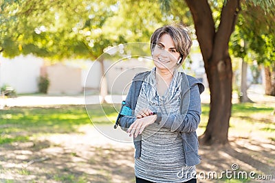 Happy Woman With Wearable Computer Making Eye Contact Stock Photo