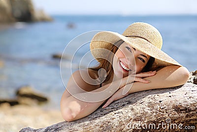 Happy woman with white smile looking sideways on vacations Stock Photo