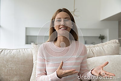 Happy woman with wireless earphones in ears shot portrait Stock Photo