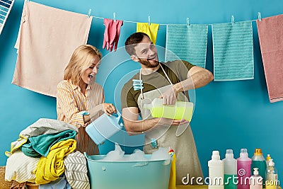 Happy woman and man pour rinsing liquid Stock Photo