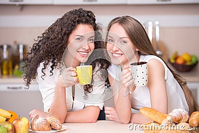 Happy women with the morning cups of tea Stock Photo