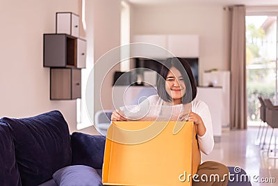 Happy women opening a gift box at home,Surprise day Stock Photo
