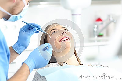 Woman with perfect smile in a dentist office Stock Photo