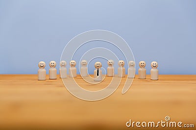 Happy wooden figures of a team Stock Photo