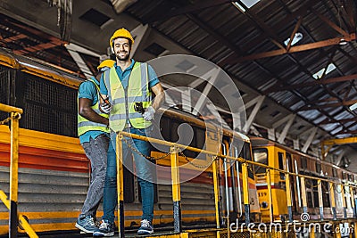 happy worker engineer male working heavy industry locomotive service staff smiling enjoy at work Stock Photo