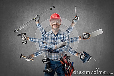 Happy worker handyman Jack of all trades or builder with construction tools Stock Photo