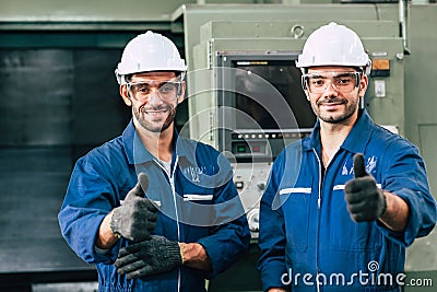 Happy worker team smiling hand show thumb up for good working in factory Stock Photo