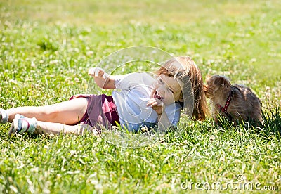 Happy 3 years girl with puppy Stock Photo