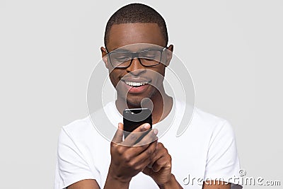 Happy young african man using smartphone gadget social media apps Stock Photo