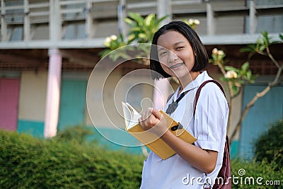 Happy young asian girl wear unifrom at school Stock Photo