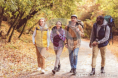 Happy young backpackers in forest Stock Photo