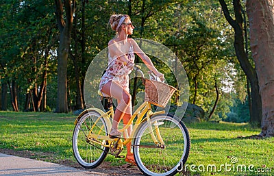 Happy young bicyclist riding in city. Stock Photo