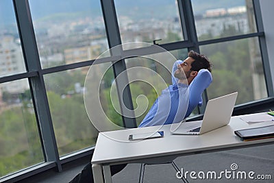 Happy young business man at office Stock Photo