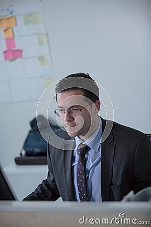 Happy young business man work in modern office.Handsome businessman in office.Real economist bussinesmen, not a model Stock Photo