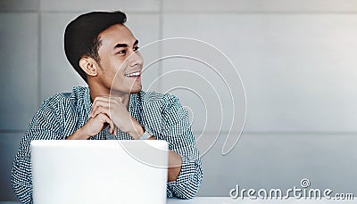 Happy Young Businessman Working on Computer Laptop in Office Stock Photo