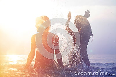 Happy young couple on the beach Stock Photo