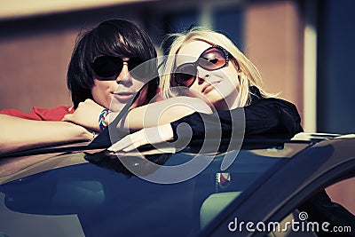 Happy young couple in a convertible car Stock Photo