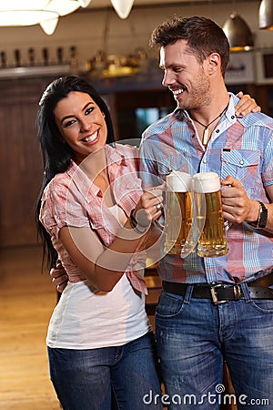 Happy young couple drinking beer Stock Photo