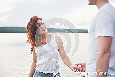 Happy young couple enjoying a solitary beach backriding Stock Photo