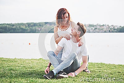 Happy young couple enjoying a solitary beach backriding Stock Photo