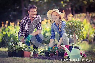 Happy young couple gardening together Stock Photo