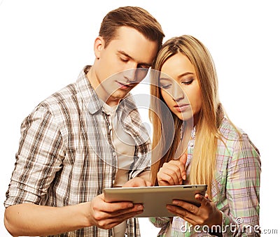 Happy young couple holding tablet pc computer Stock Photo