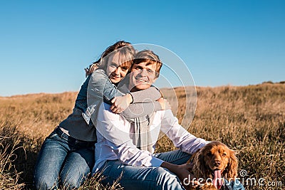 Happy young couple hugging and laughing outdoors. Stock Photo