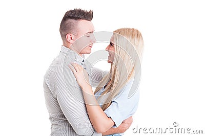 Happy young couple hugging and looking at each other Stock Photo