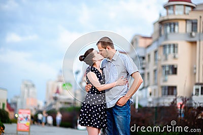 Happy young couple kissing in the city Stock Photo