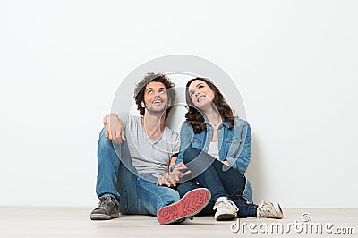 Happy Young Couple Looking Up Stock Photo