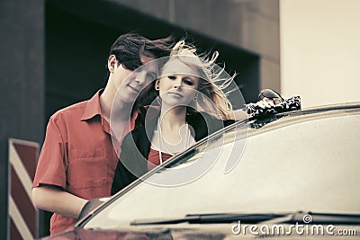 Happy young couple in love with new car Stock Photo