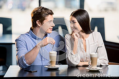 Happy young couple in love at romantic date in restaurant Stock Photo