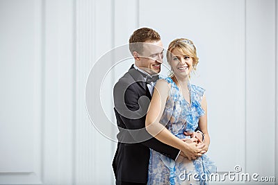 Happy young couple in luxury fashionable clothes indoors Stock Photo