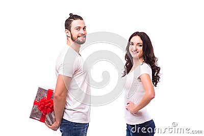 Happy young couple with Valentine's Day present isolated on a white background. Stock Photo