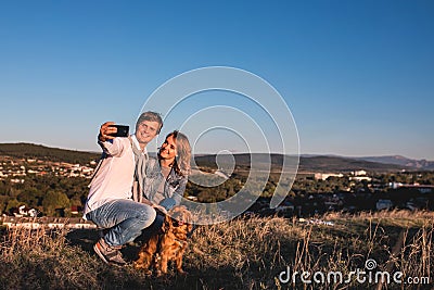 Happy young cute couple making selfie outdoors Stock Photo