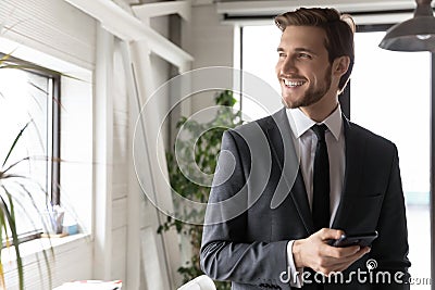 Happy young dreamy ceo manager thinking of business opportunity. Stock Photo