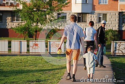 Happy young family spending time together outside in green nature Editorial Stock Photo