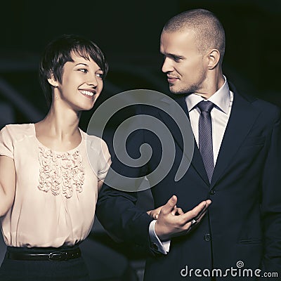 Happy young fashion couple in love walking in night city street Stock Photo