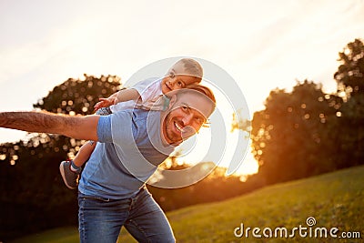 Happy young father with son in park Stock Photo