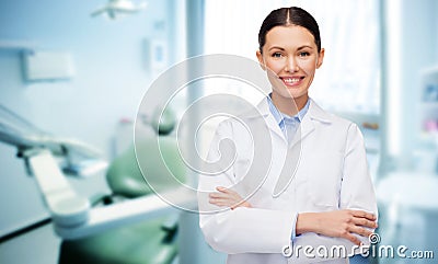 Happy young female dentist with tools Stock Photo