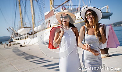 Happy young female on luxury vacation. Travel, shopping, fun, friends concept Stock Photo