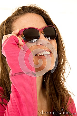 Happy young female model sporting pink sunglasses Stock Photo