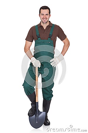 Happy young gardener in dungarees Stock Photo