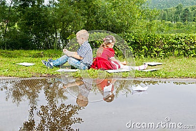 Happy Young girl and boy Writing .Smiling in Stock Photo