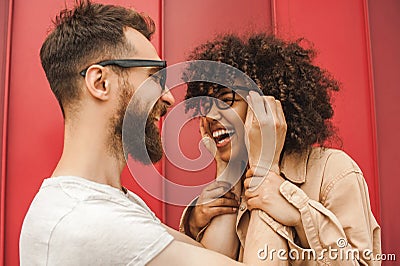 happy young interracial couple in eyeglasses having fun together Stock Photo