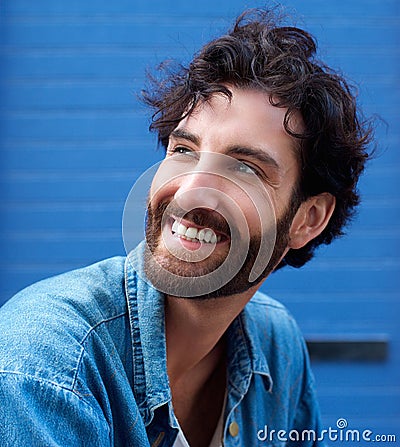 Happy young man with beard smiling Stock Photo